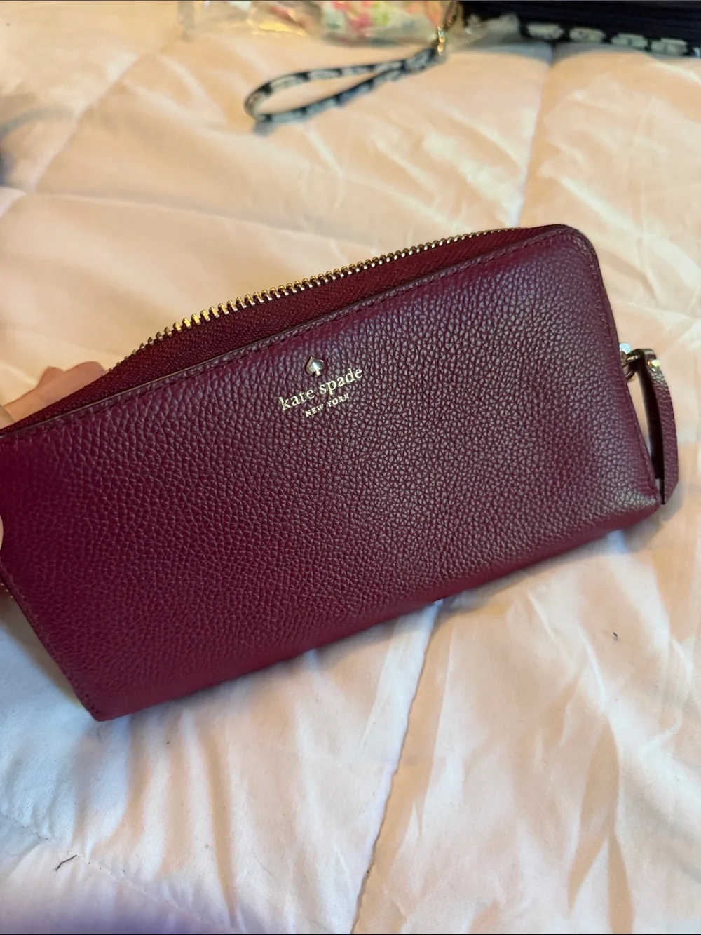 kate spade Pebbled Leather Wristlet in Deep Wine